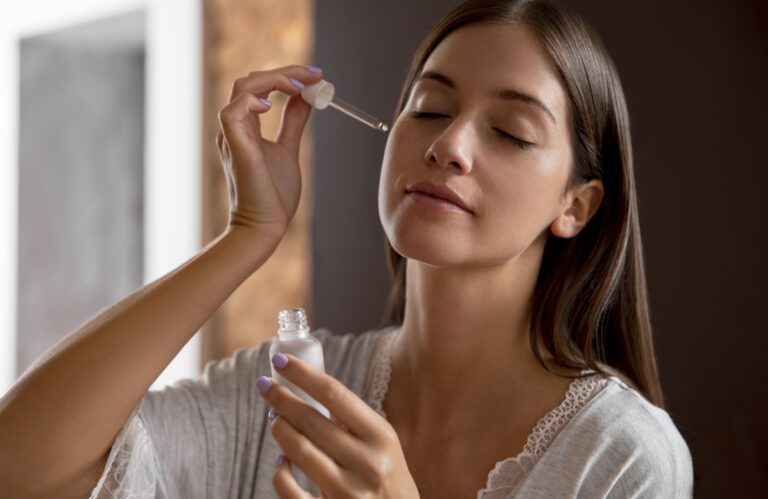 Applying skincare serum with dropper