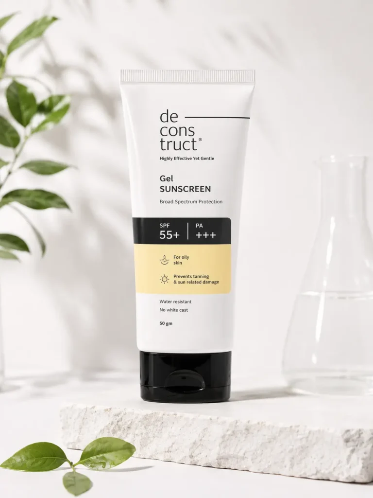 Deconstruct Gel Sunscreen SPF 55+ for oily skin placed on a clean white aesthetic background with soft natural lighting, green leaves, and minimalist skincare product styling.